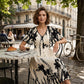 Vestido midi elegante con escote en V y estampado botánic