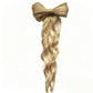 Coleta con lazo para un look glamuroso al instante